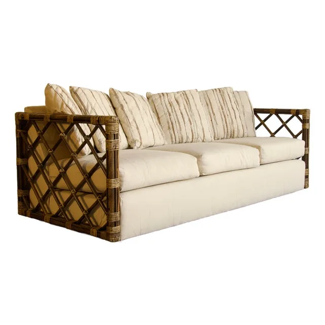 Vintage Rattan Trellis Lattice Sofa in the Style of McGuire With Casters, Wrapped Joints, and Ivory Upholstery, 1970s